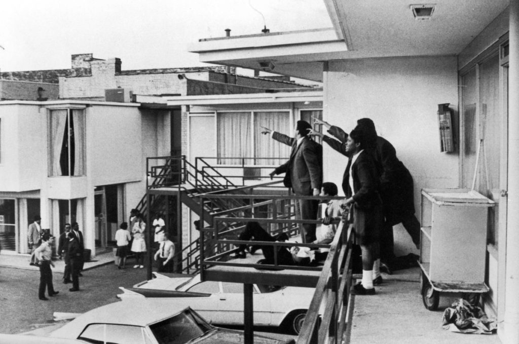 TENNESSEE, UNITED STATES - APRIL 04: Civil rights leader Andrew Young (L) and others standing on balcony of Lorraine motel pointing in direction of assailant after assassination of civil rights leader Dr. Martin Luther King, Jr., who is lying at their feet. (Photo by Joseph Louw/The LIFE Images Collection/Getty Images)